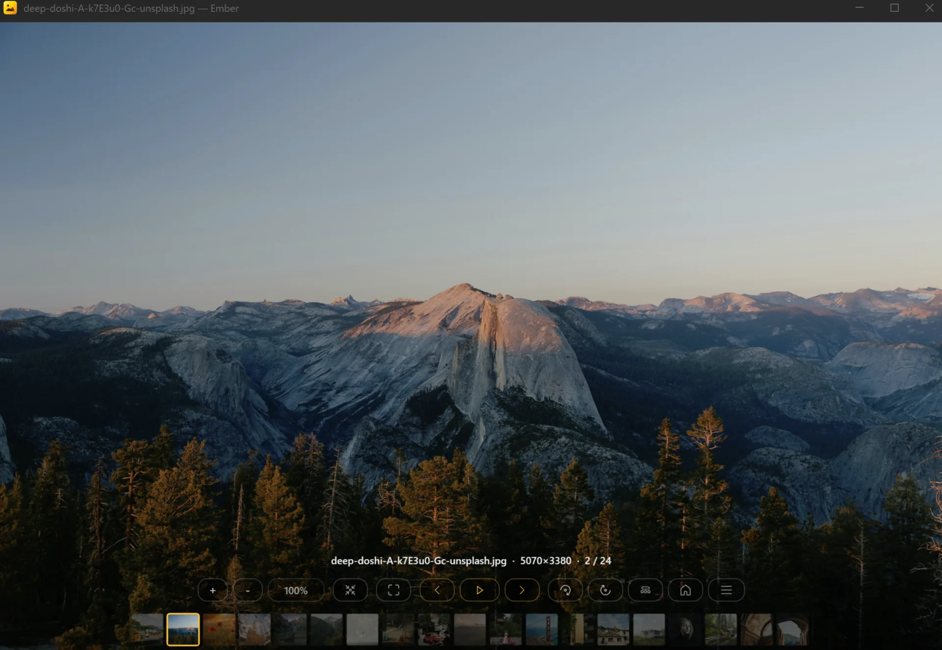 Ember image viewer in windowed mode showing a Yosemite landscape with the bottom toolbar and filmstrip